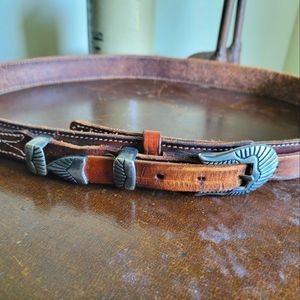 Leather belt with intricate hardware